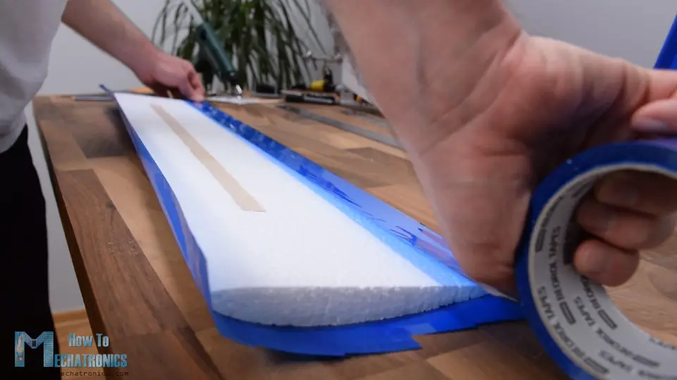 Wrapping the Arduino RC Airplane wing with a packing tape