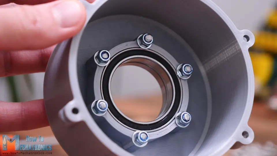 Securing the bearings to the Harmonic Drive housing